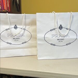 2 Prada shopping bags